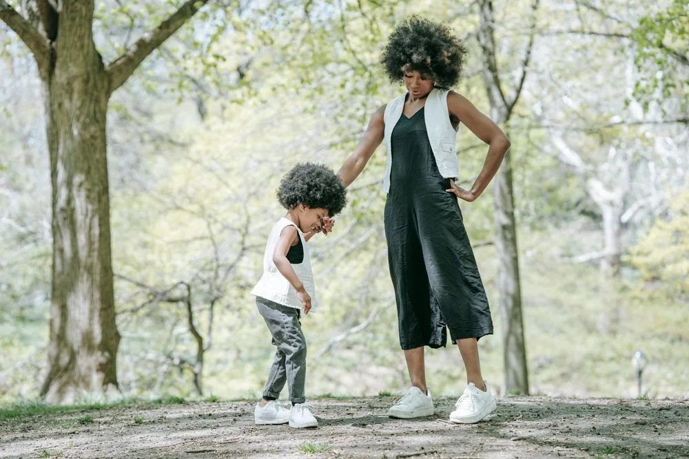 A mother and child sharing a quiet moment outdoors